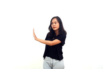 Profile side view portrait of young girl black shirt standing with stop hand sign gesture.