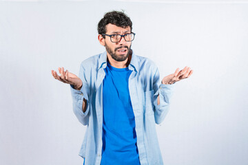 Man spreading palms, feeling clueless and uncertain, man spreading hands bewildered, concept of a...