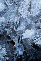 Macro close-up of abstract ice formations in the winter, viewed from above. Abstract full frame textured background with copy space. Top view.