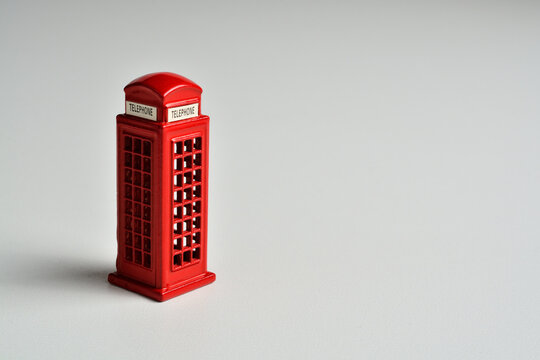 English red phone booth isolated on white.