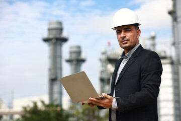 Business man or management survey and audit at site line of factory, Cogeneration Power plant investment