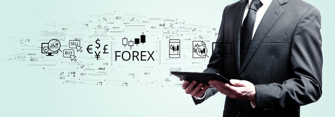 Forex trading concept with businessman holding a tablet computer