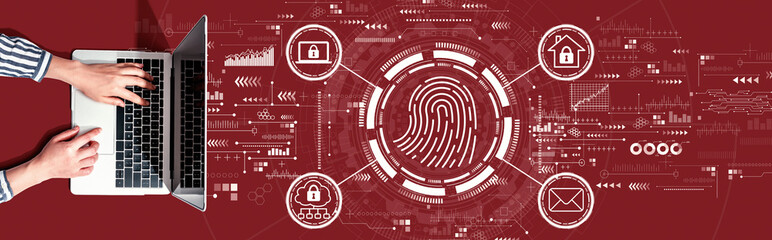 Fototapeta na wymiar Fingerprint scanning theme with person using a laptop computer