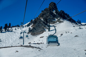 Gondola lift going up at the Snowbasin Ski Resort in Utah.