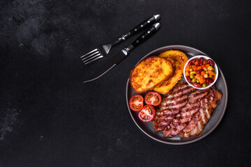 Slices of delicious grilled bacon with croutons fried in egg with spices, salt, vegetables and herbs