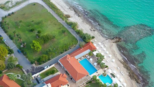 Aerial view Beach resort with hotel on the shores of the beautiful seaside. Hotel with swimming pool on the shores of the Ionian Sea.