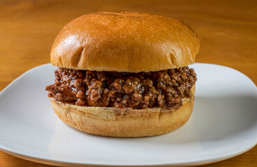 sloppy joe between  brioche bun