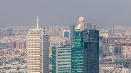 Aerial view of skyscrapers with World Trade center in Dubai timelapse.