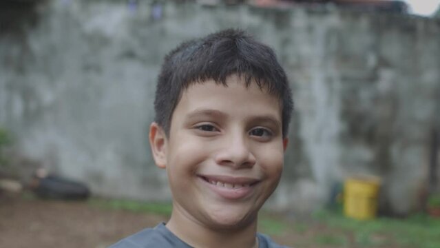 child smiling with his ball