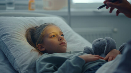Sad girl lying hospital bed hug toy portrait. Doctor checking patient symptoms