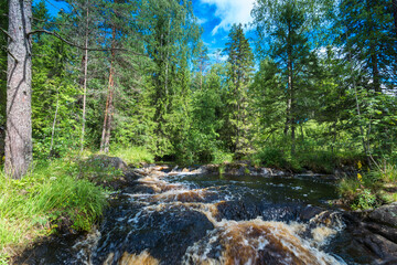 Fototapeta na wymiar Ruskeala Falls. Wonderful natural park in northern Russia, Republic of Karelia. Not far from the town of Sortavala