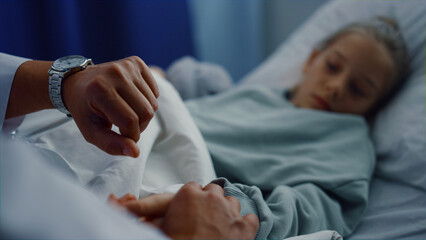 Obraz na płótnie Canvas Upset girl lying hospital bed undergoing medical examination in ward portrait.