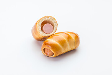 Sausage in the dough and half of the sausage in the dough