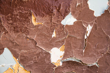 Fototapeta premium Cracked paint texture. Grunge wall texture. Dark wall with old paint