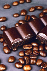 Dark porouse chocolate and coffee beans flat lay. Brown background