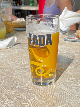 Gr&eacute;oux-les-Bains, France - April 27, 2022: Glass of Fada beer, a France regional lager styled beer.