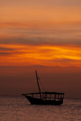 Zanzibar, Tanzania, Sunset on the Indian Ocean with boats.
