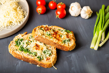 Delicious garlic bread with ingredients flat lay view
