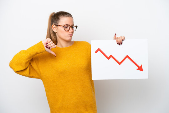 Young caucasian woman isolated on white background holding a sign with a decreasing statistics arrow symbol and doing bad signal