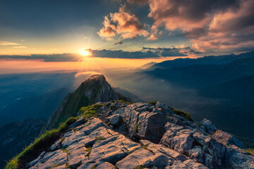 Cloudy, spectacular sunrise view on the top of the rocky Giewont peak of Tatry mountains. Landscape...