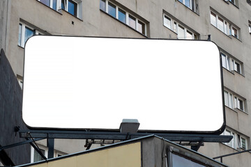 Advertising billboard mock-up mounted on the roof of building in the city center