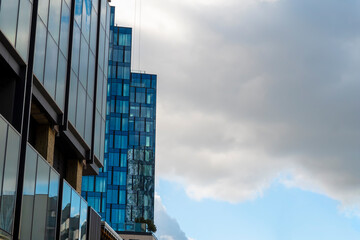 Modern office building with glass facade on a sunny summer day