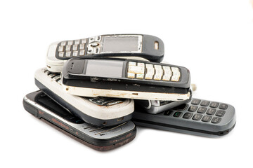 Old mobile phone in different colors. Retro technology of cellular devices located on a white background. Old technical display