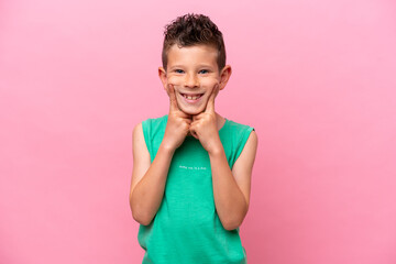 Little caucasian boy isolated on pink background smiling with a happy and pleasant expression