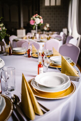 table setting for a wedding reception and flowers