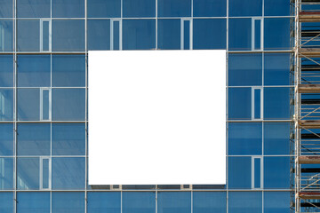 Blank white advertising banner on the wall of modern office building under construction