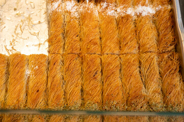 Turkish or arabic sweet dessert, baklava made from filo pastry, filled with chopped nuts and sweetened with syrup or honey.