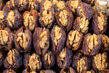 Turkish or arabic sweet dessert, ripe dried dadels with walnuts sweetened with syrup or honey.