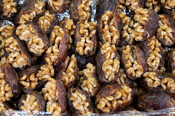 Turkish or arabic sweet dessert, ripe dried dadels with walnuts sweetened with syrup or honey.
