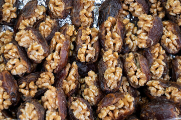 Turkish or arabic sweet dessert, ripe dried dadels with walnuts sweetened with syrup or honey.