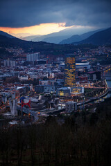 Dusk, twilight over Bilbao city in Basque Country, Spain. Town between mountains.
