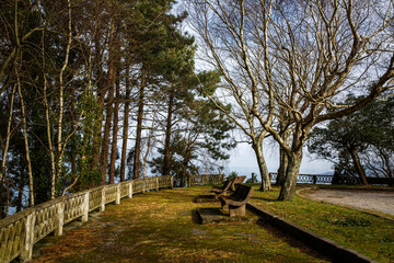 Fototapeta premium The stone benches are on a beautiful viewpoint in Spain. Mirador in the Basque country near Bilbao.