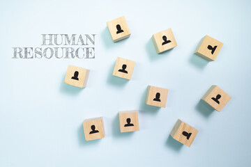 Top view wooden blocks with people icon on blue background. Concept for company and human resorce manangement.