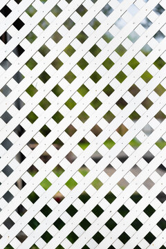 White wooden garden trellis.White lattice fence in the garden
