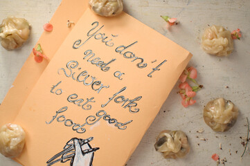 Dumplings with handwritten note and painting: you don’t need a silver fork for good food....