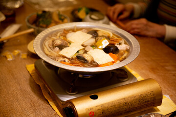 Shellfish in a hot pot soup in Japan.