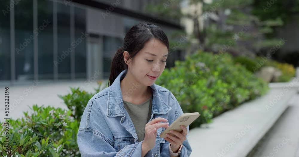 Poster Woman look at mobile phone in city