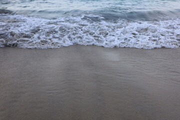 Soft blue ocean wave on the beach and soft wave background.