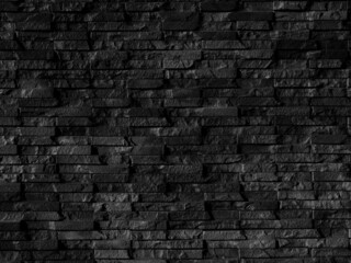 Seamless texture of black brick stone wall a rough surface, with space for text, for a background....