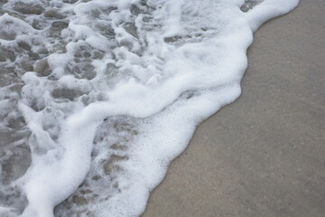 Soft blue ocean wave on the beach and soft wave background.