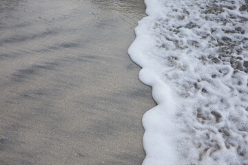 Soft blue ocean wave on the beach and soft wave background.