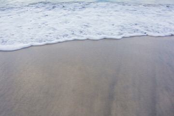 Small wave, Soft wave on sand beach for opening video, text space. white sand beach, Ocean Wave On Sandy Beach