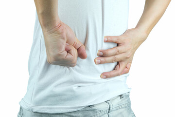 A man presses his hand against his back, has back pain and bone pain.