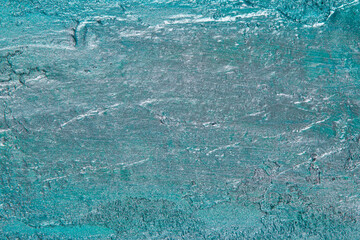 abstract background: textured plaster with emerald turquoise color, close