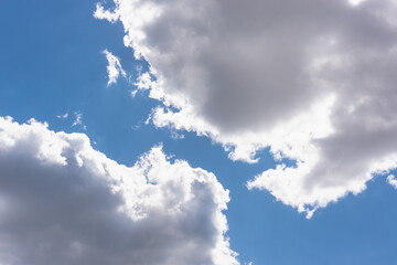 Clouds in the sky and the sun on the edges of the cloud.