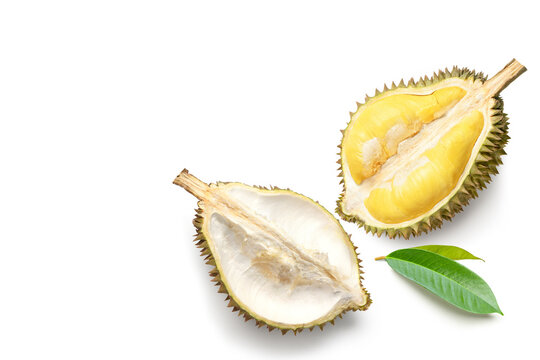 Flat lay of Durian fruit cut in half with leaves isolated on white background.